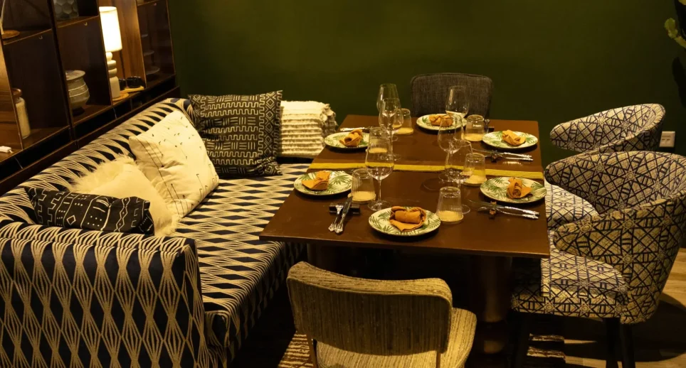 Elegant dining room with patterned seating and a set table